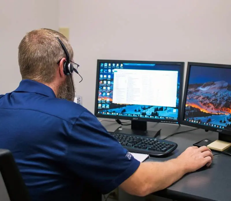 Man at Computer with Tribute's TrulinX Software 